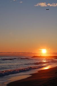 Scenic view of sea against sky during sunset