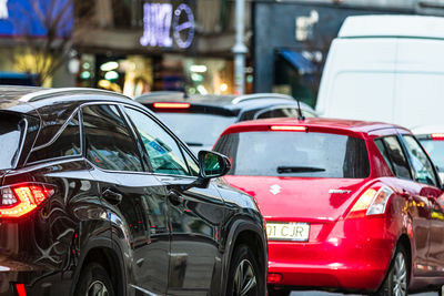 View of cars on street in city