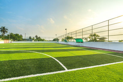 Scenic view of soccer field against sky