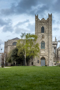 Building against sky with lawn in foreground