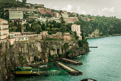 View of buildings by sea