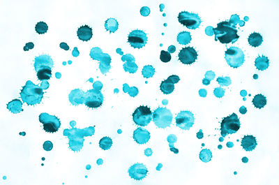 Close-up of bubbles over sea against white background