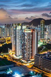 High angle view of illuminated buildings in city at night