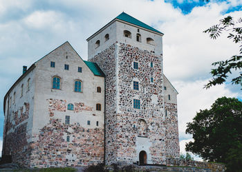 Low angle view of historic building against sky