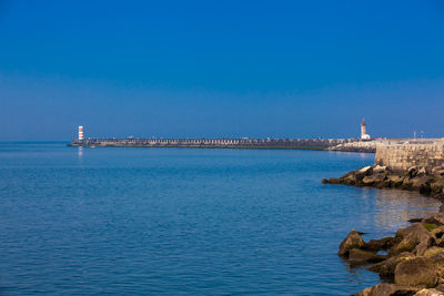 Sunny early spring day at the beautiful promenade along the porto coast near the douro river mouth