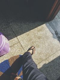 Low section of woman standing on floor