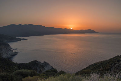 Scenic view of sea against clear sky during sunset