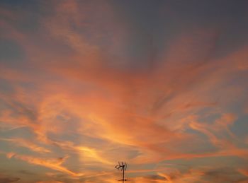 Low angle view of dramatic sky during sunset