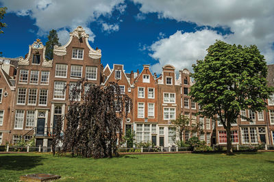 Row typical houses and garden at the begijnhof in amsterdam. the netherland capital full of canals.