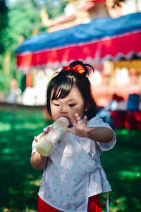 Portrait of cute girl blowing bubbles