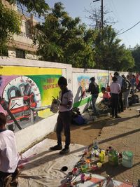 People standing on street in city