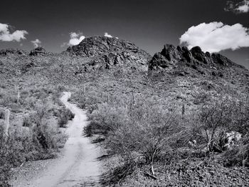 Dirt road along countryside landscape