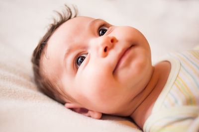 Cute baby boy on bed