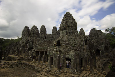 Old ruins of building against cloudy sky