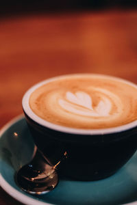 Close-up of coffee cup on table