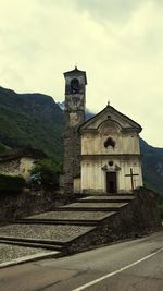 View of bell tower against cloudy sky