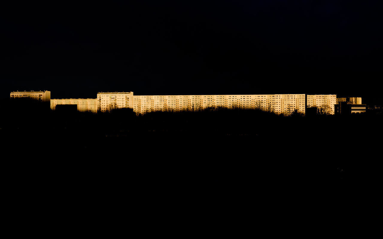 SILHOUETTE BUILDINGS AT NIGHT