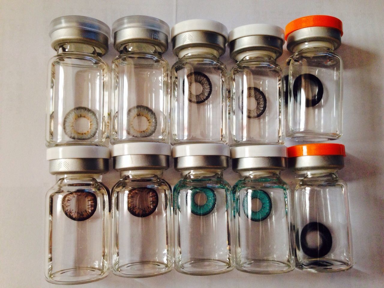 indoors, food and drink, still life, drink, glass - material, refreshment, drinking glass, table, close-up, bottle, transparent, glass, freshness, container, side by side, variation, arrangement, jar, no people, large group of objects