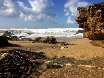 Scenic view of beach against sky