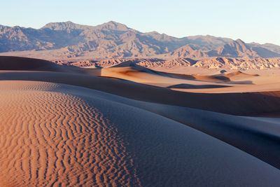 Scenic view of desert against clear sky