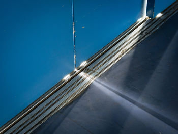 High angle view of illuminated bridge against blue sky