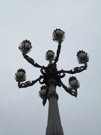 Low angle view of street light against sky