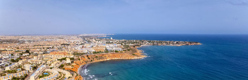 High angle view of sea against blue sky