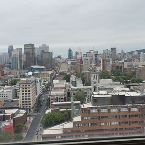 High angle view of buildings in city against sky