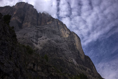 Low angle view of rock formation against sky