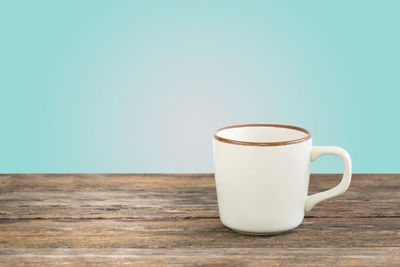 Close-up of cup on table