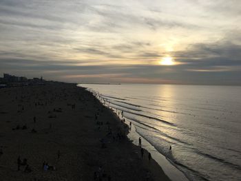 Scenic view of beach against sky during sunset