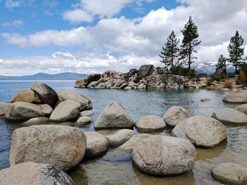 Rocks on beach against sky