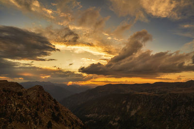 Scenic view of mountains against sky during sunset