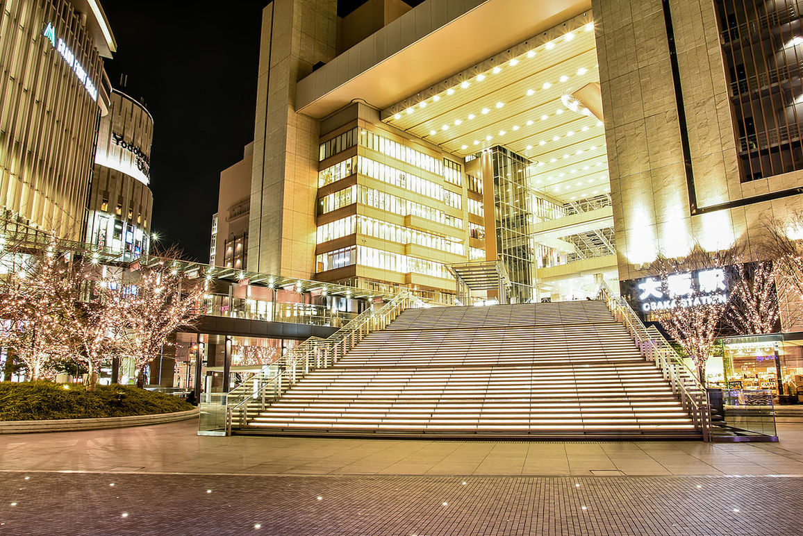 VIEW OF ILLUMINATED BUILDINGS AT NIGHT