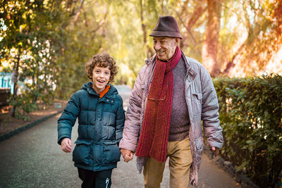 Portrait of happy friends walking outdoors