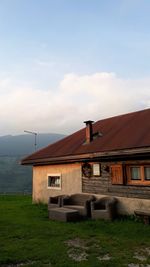 House on field against sky