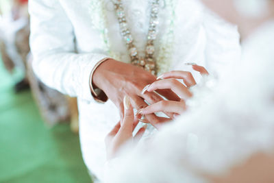 Close-up of woman holding hands