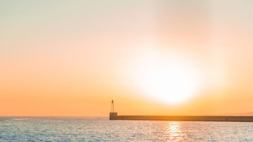 View of calm sea at sunset