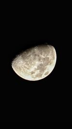 Low angle view of moon against sky at night