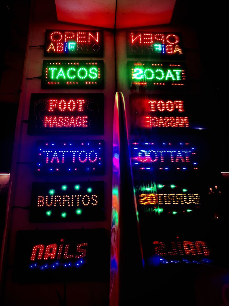 LOW ANGLE VIEW OF ILLUMINATED INFORMATION SIGN