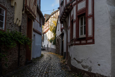 Narrow alley amidst buildings in city