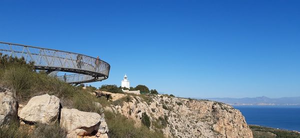 Scenic view of mountain against clear blue sky