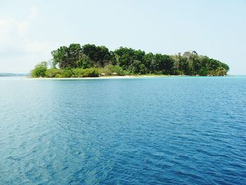 Scenic view of calm sea against blue sky