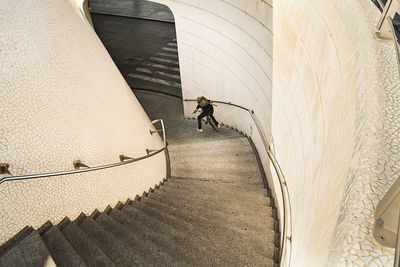 High angle view of man riding bicycle on staircase