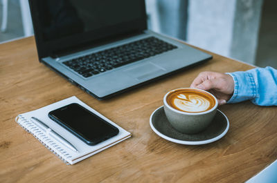 High angle view of coffee cup on table