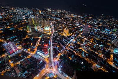 High angle view of illuminated city buildings at night