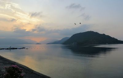 Scenic view of sea against sky during sunset