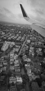 Aerial view of buildings in city against sky