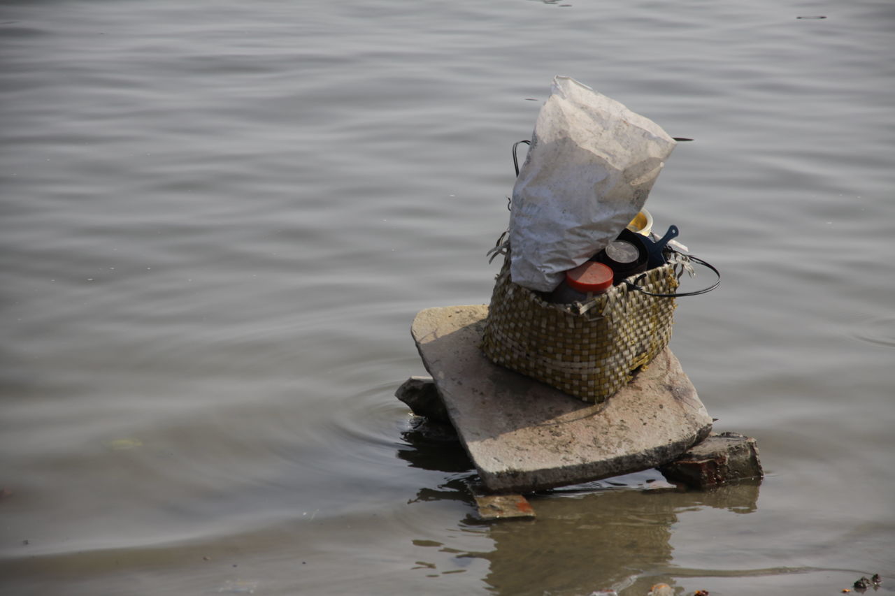 BOAT TIED ON RIVERBANK