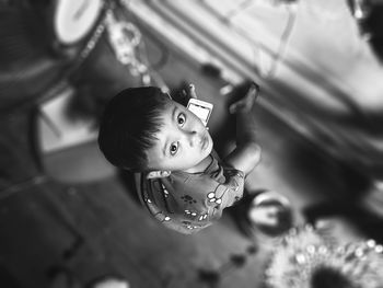 High angle portrait of boy using phone at home